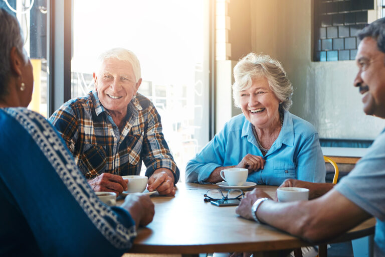 Senior, people and group relax on holiday at cafe on vacation in retirement. Elderly, friends and talk at coffee shop with latte, espresso and drink cappuccino and chat in city morning with tea.